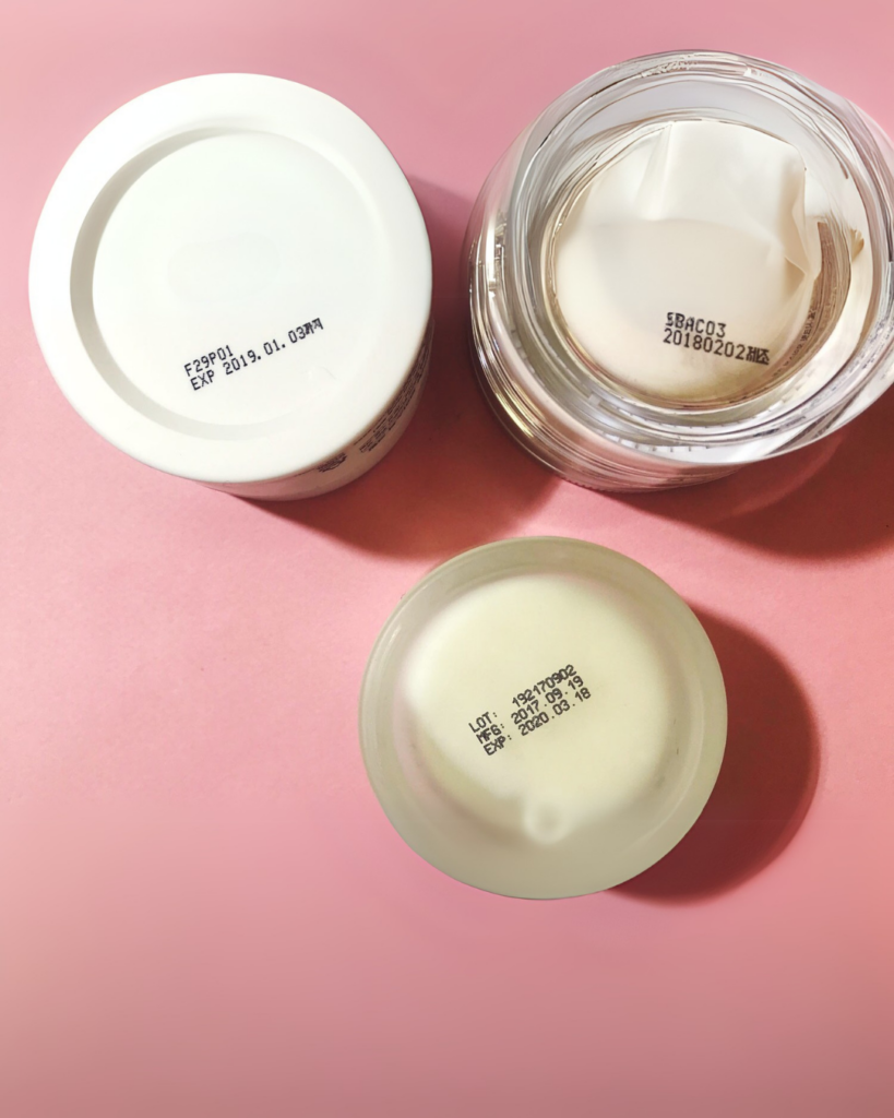 3 skincare products showing the expiry date and batch record on the bottom of the tub.