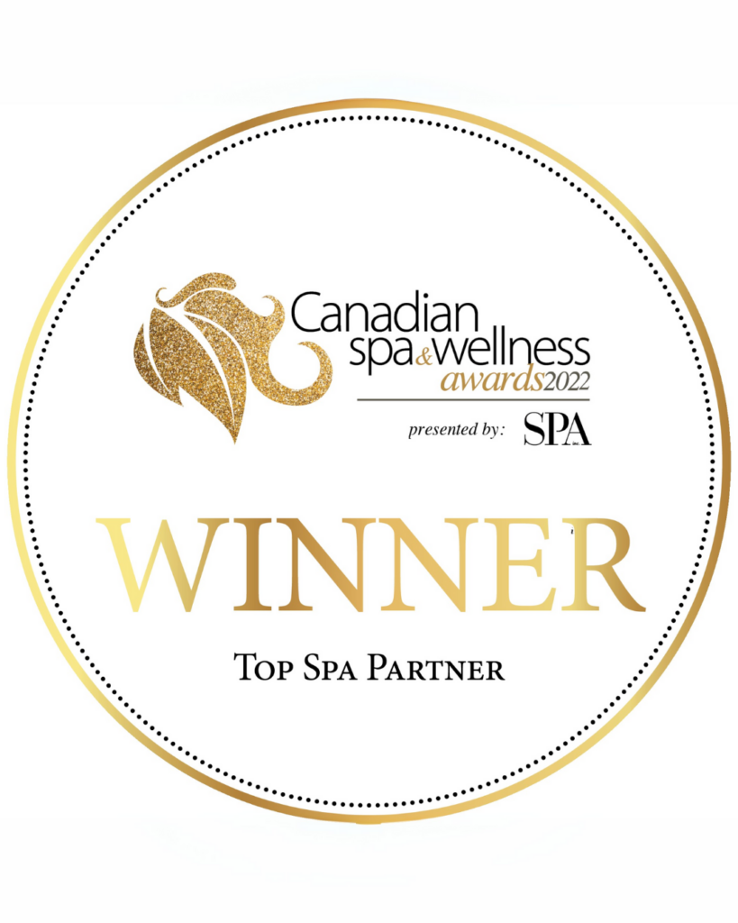 Canadian Spa & Wellness Awards 2022 gold trophy with skincare products